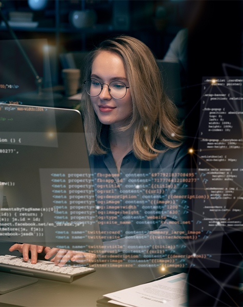 A women is working on her desktop and her coding skill is shown in blur form